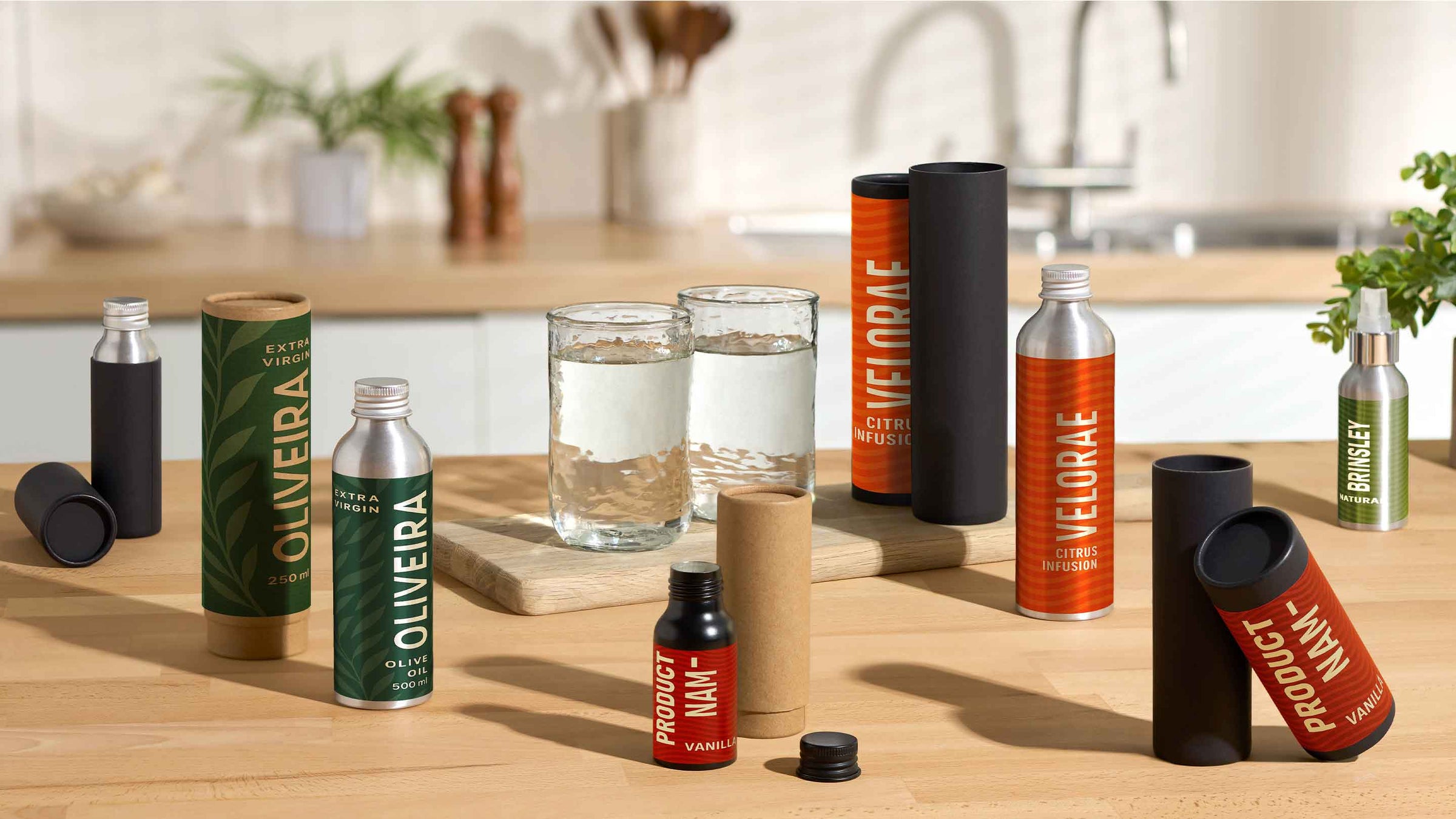 Telescopic cardboard tubes with aluminium bottles in kitchen background. 
